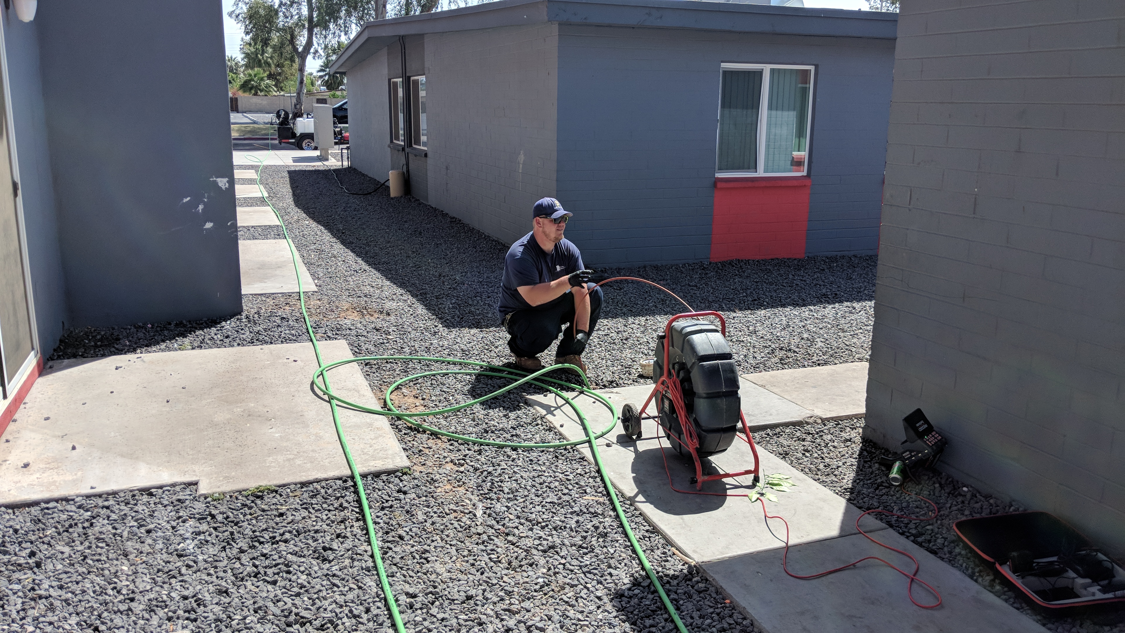 Commercial plumber inspecting plumbing system in an Arizona apartment community